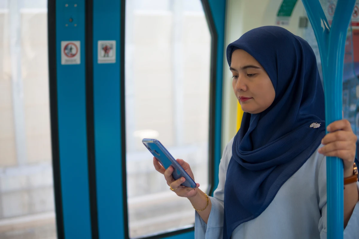 woman on phone on public transit